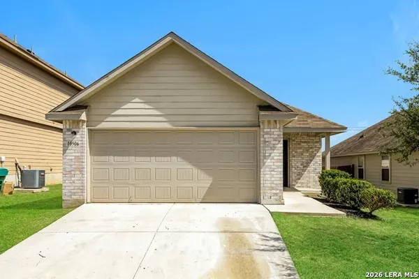 a view of house with backyard