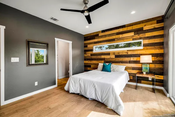 a bedroom with a bed and a table