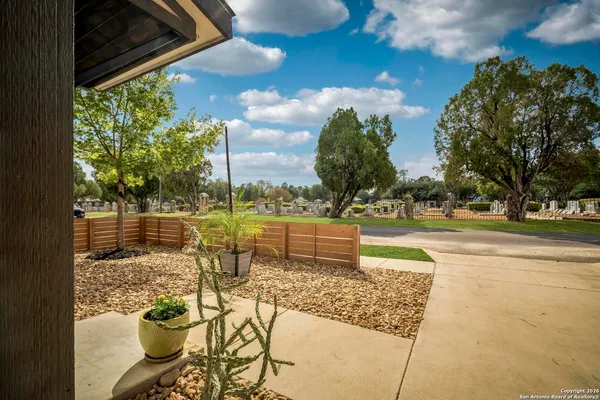 a view of a swimming pool with a patio