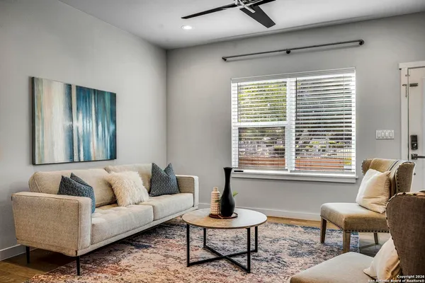 a living room with furniture and a window