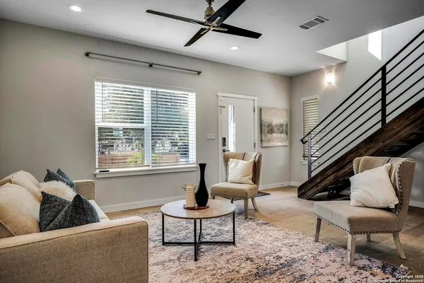 a living room with furniture and a couch