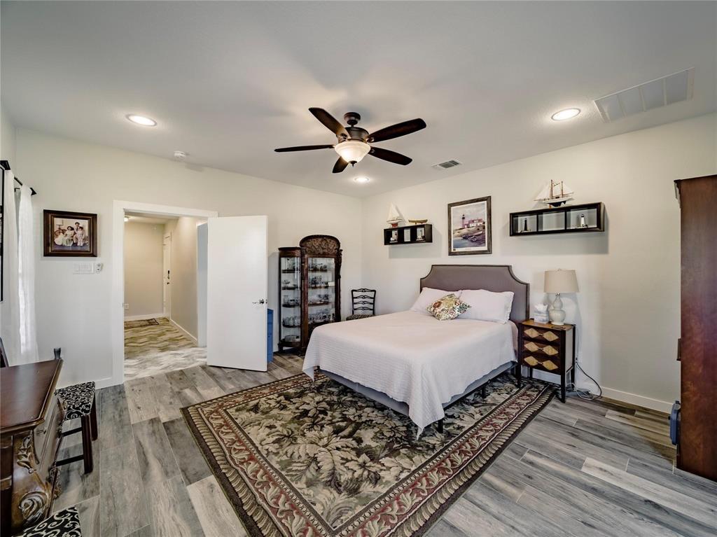 2107 Countryside Drive Denton, TX 76208 - Photo 16 of 40 a bedroom with bed and wooden floor