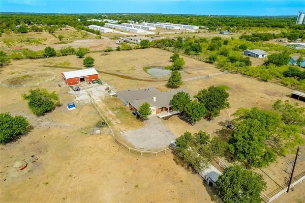 a swimming pool with some trees in the background