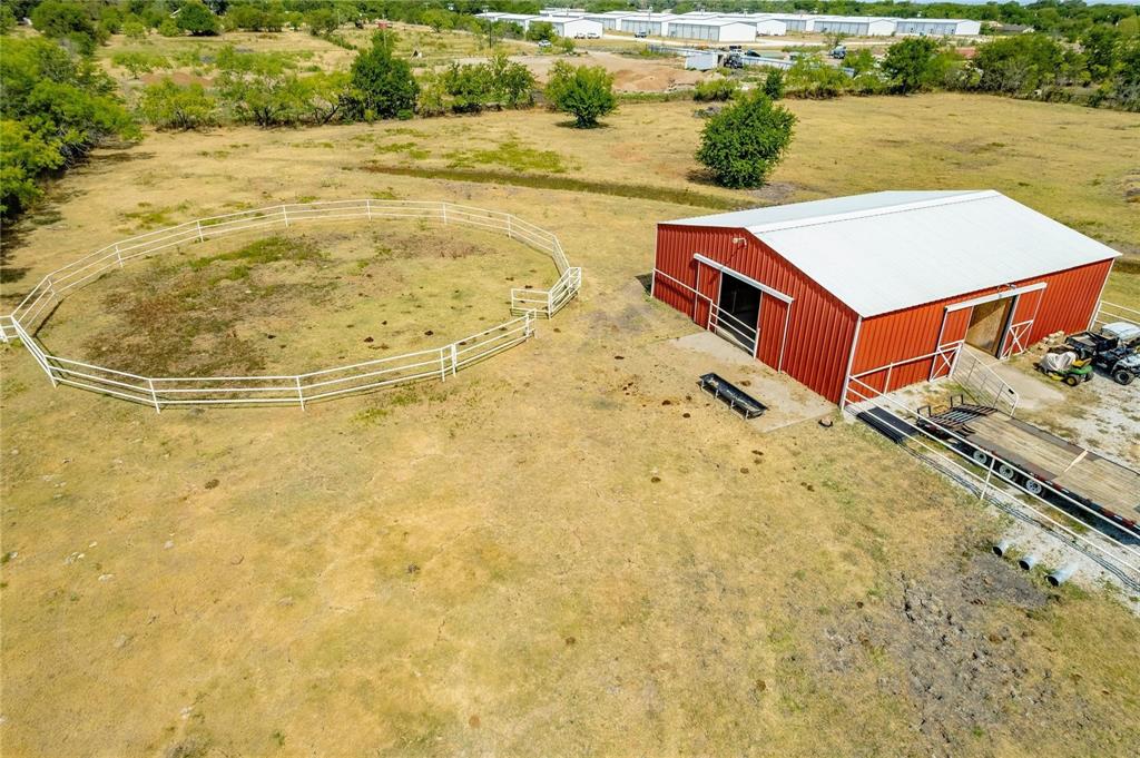 2107 Countryside Drive Denton, TX 76208 - Photo 39 of 40 a swimming pool with some trees in the background