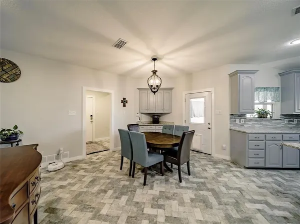 a view of a dining room with furniture
