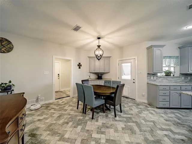 a view of a dining room with furniture