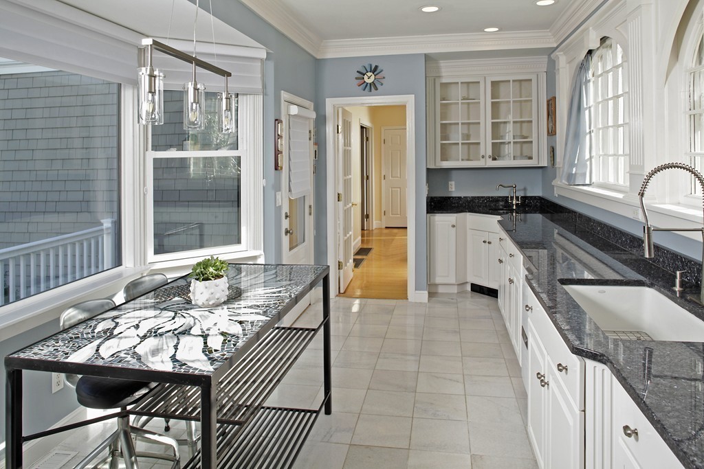 74 Branch Street, Unit 3 Scituate, MA 02066 - Photo 8 of 21 a kitchen with granite countertop lots of counter top space and stainless steel appliances