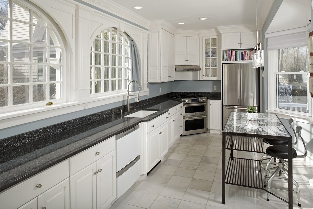 74 Branch Street, Unit 3 Scituate, MA 02066 - Photo 9 of 21 a kitchen with granite countertop stainless steel appliances a sink and cabinets