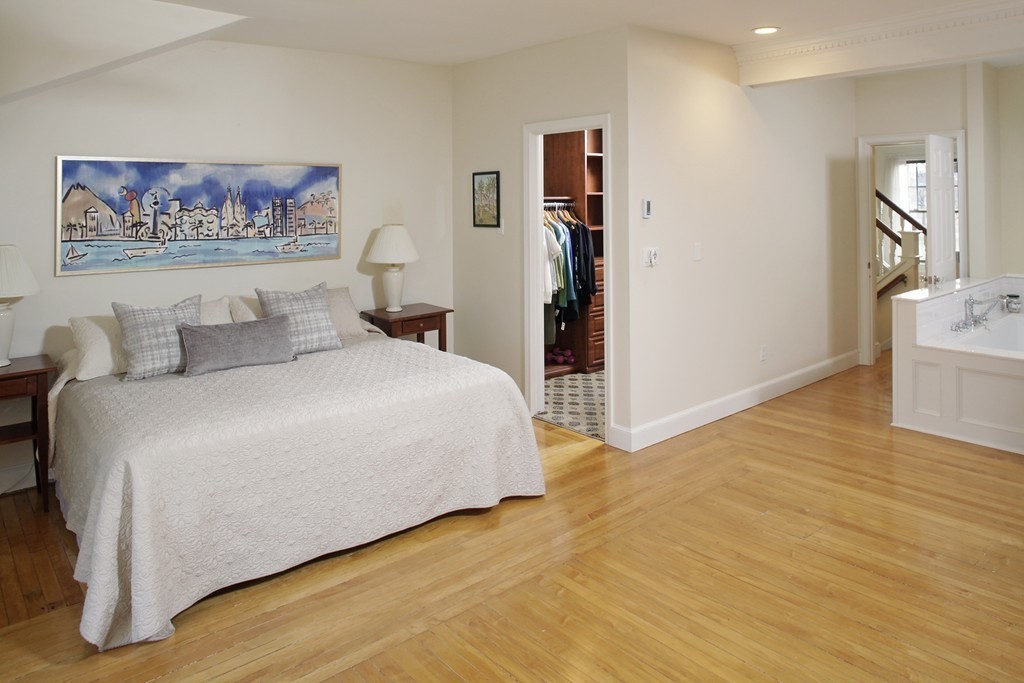 74 Branch Street, Unit 3 Scituate, MA 02066 - Photo 10 of 21 a bedroom with a bed and a flat screen tv