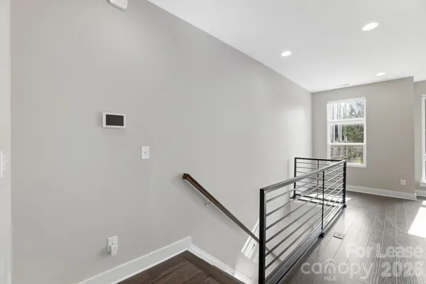 a view of entryway with wooden floor