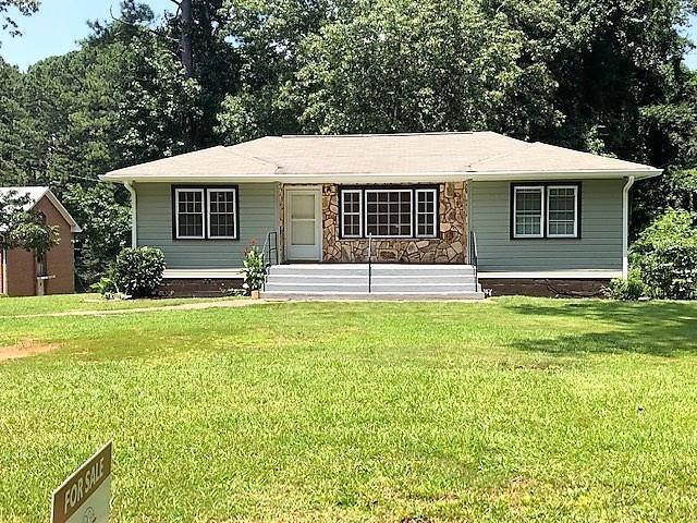 3487 Washington Road East Point, GA 30344 - Photo 1 of 1 a front view of house with yard and green space