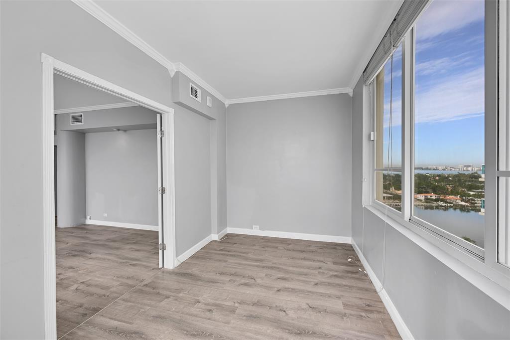5005 Collins Avenue, Unit PH6 Miami Beach, FL 33140 - Photo 12 of 34 a view of an empty room with a window