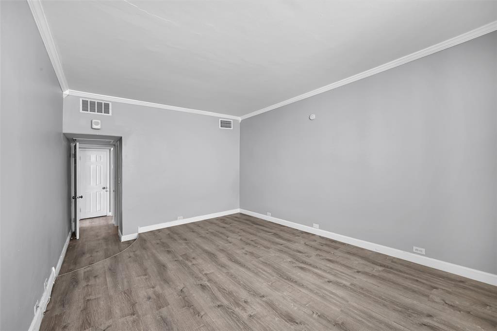 5005 Collins Avenue, Unit PH6 Miami Beach, FL 33140 - Photo 16 of 34 a view of a room with wooden floor