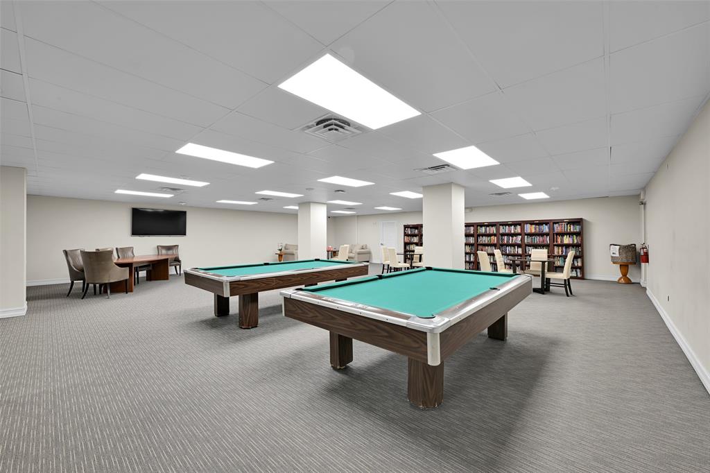 5005 Collins Avenue, Unit PH6 Miami Beach, FL 33140 - Photo 21 of 34 a room with pool table and windows