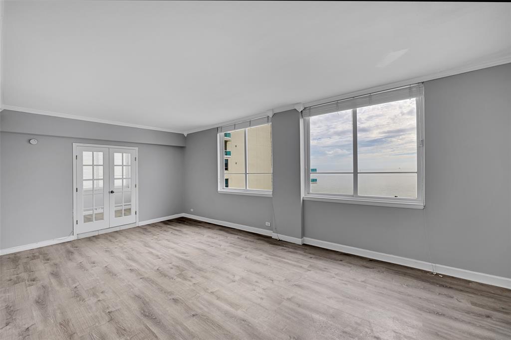 5005 Collins Avenue, Unit PH6 Miami Beach, FL 33140 - Photo 8 of 34 an empty room with windows