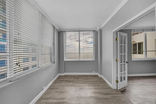 a view of an empty room with a window