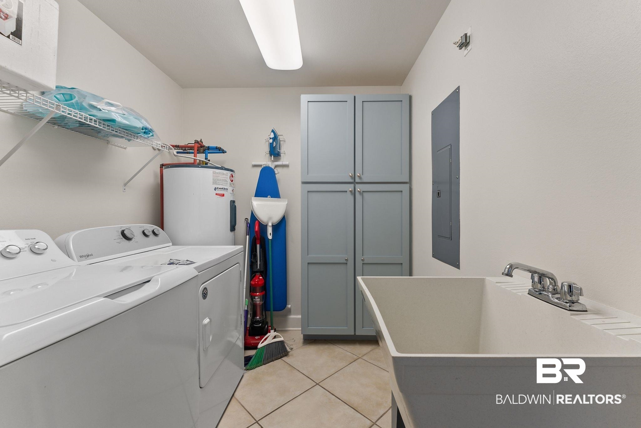 27580 Canal Road, Unit 1233 Orange Beach, AL 36561 - Photo 16 of 79 Laundry area featuring independent washer and dryer, electric water heater, cabinet space, light tile patterned floors, and electric panel