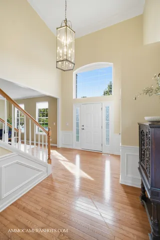 a spacious bedroom with a bed and furniture