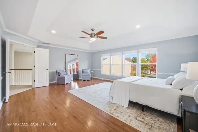 a spacious bathroom with a double vanity sink mirror and bathtub
