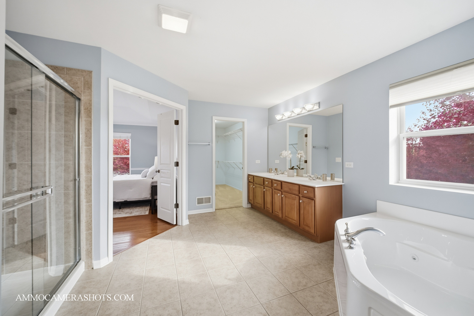 1329 Turnberry Lane Mundelein, IL 60060 - Photo 25 of 33 a spacious bathroom with a double vanity sink a mirror and a bathtub