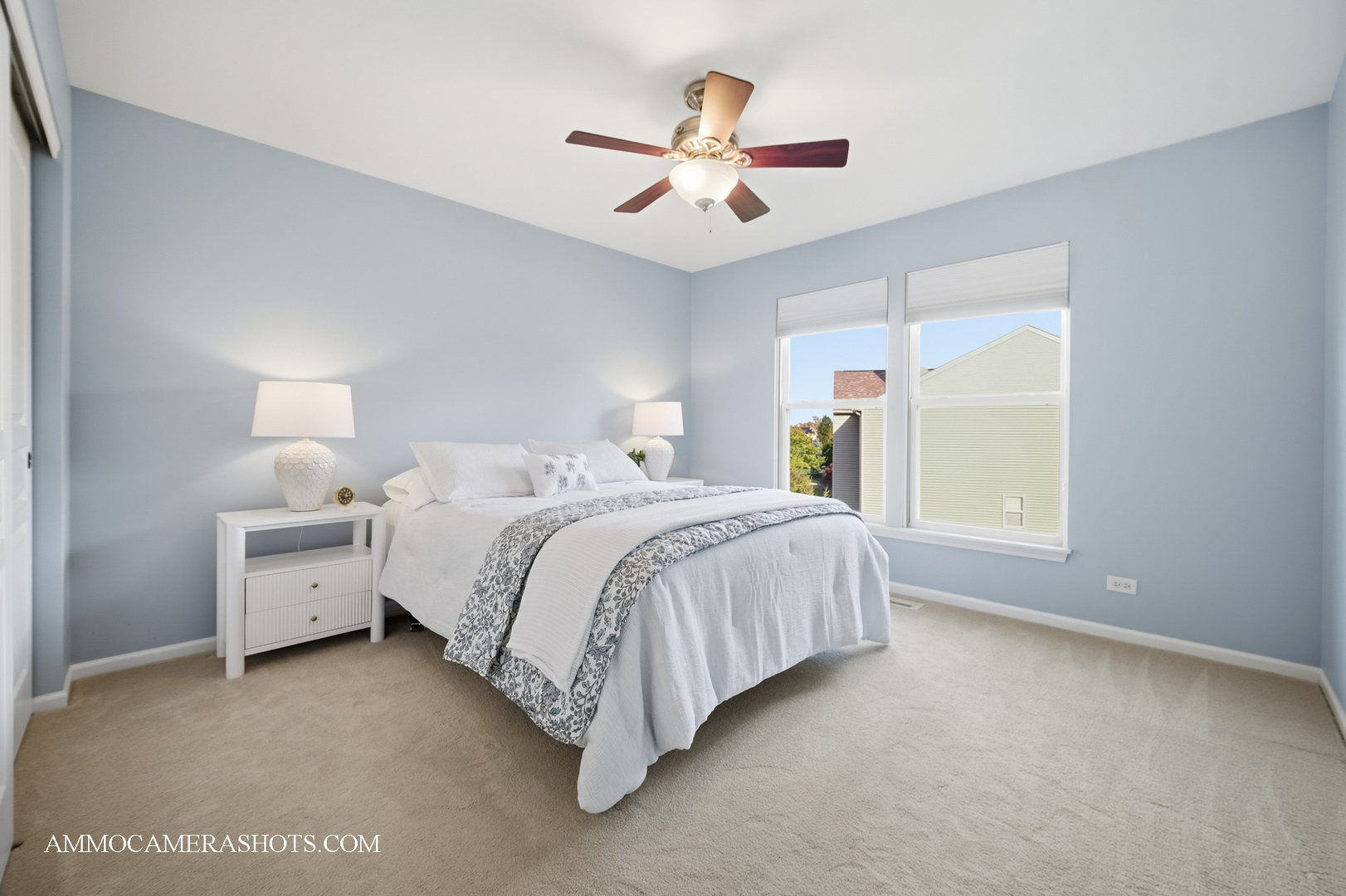 1329 Turnberry Lane Mundelein, IL 60060 - Photo 29 of 33 a spacious bedroom with a bed and a ceiling fan