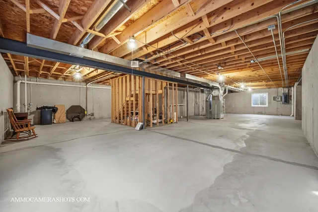 a view of a house with a big yard and large trees
