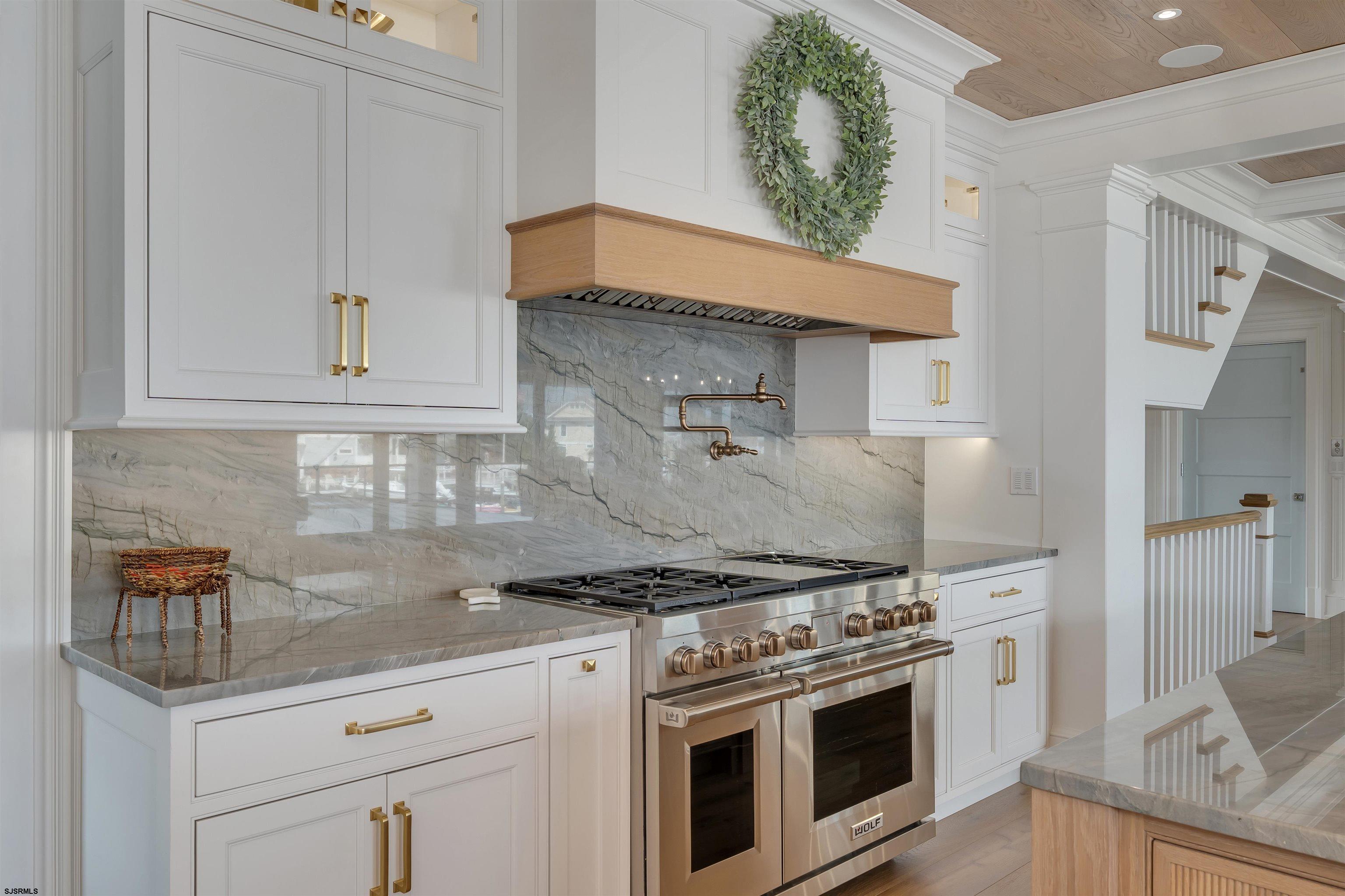 55 Walnut Road Ocean City, NJ 08226 - Photo 34 of 97 a kitchen with stainless steel appliances granite countertop a stove and a white cabinets