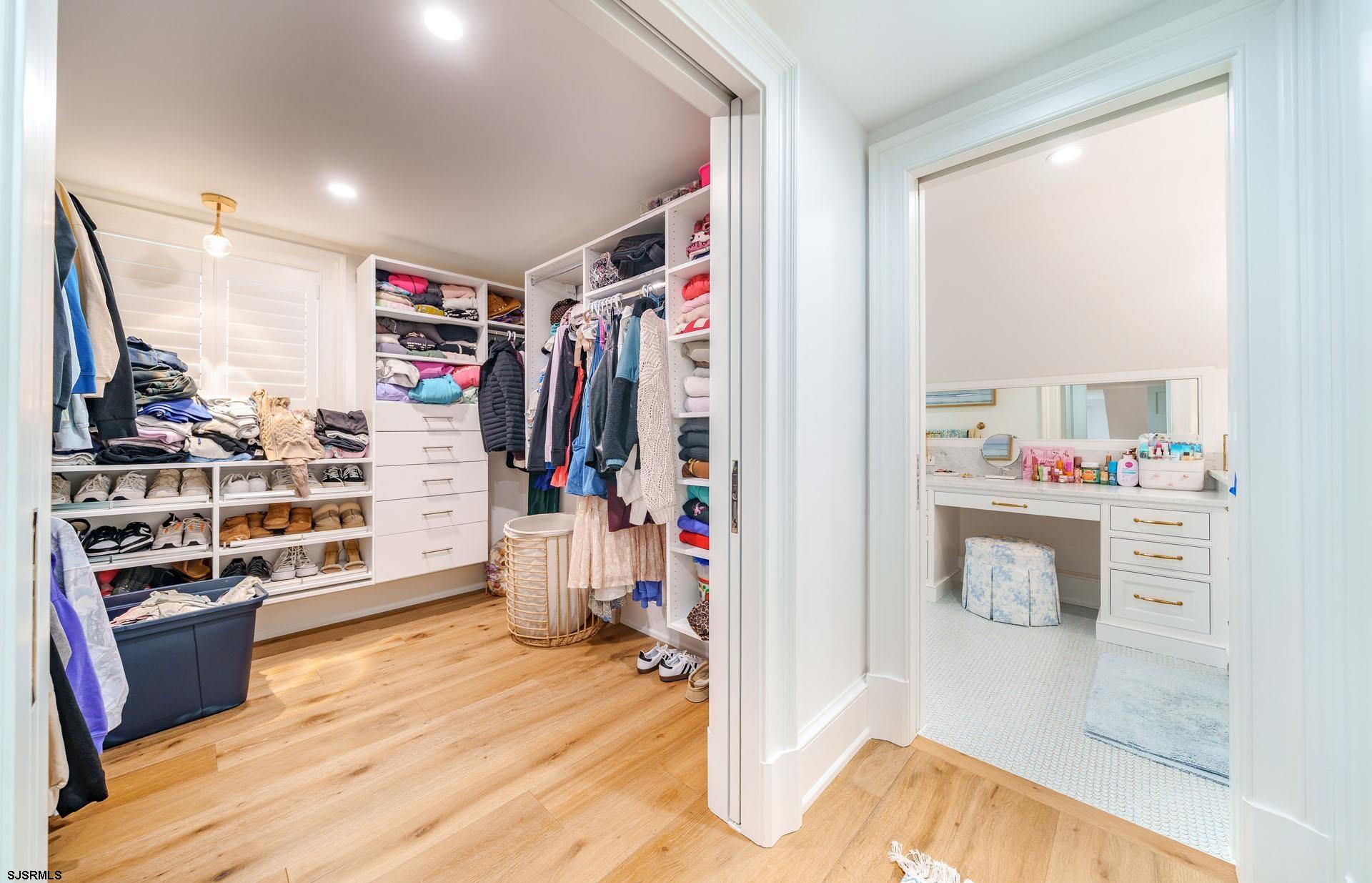 55 Walnut Road Ocean City, NJ 08226 - Photo 70 of 97 a view of a walk in closet with clothes and shoes