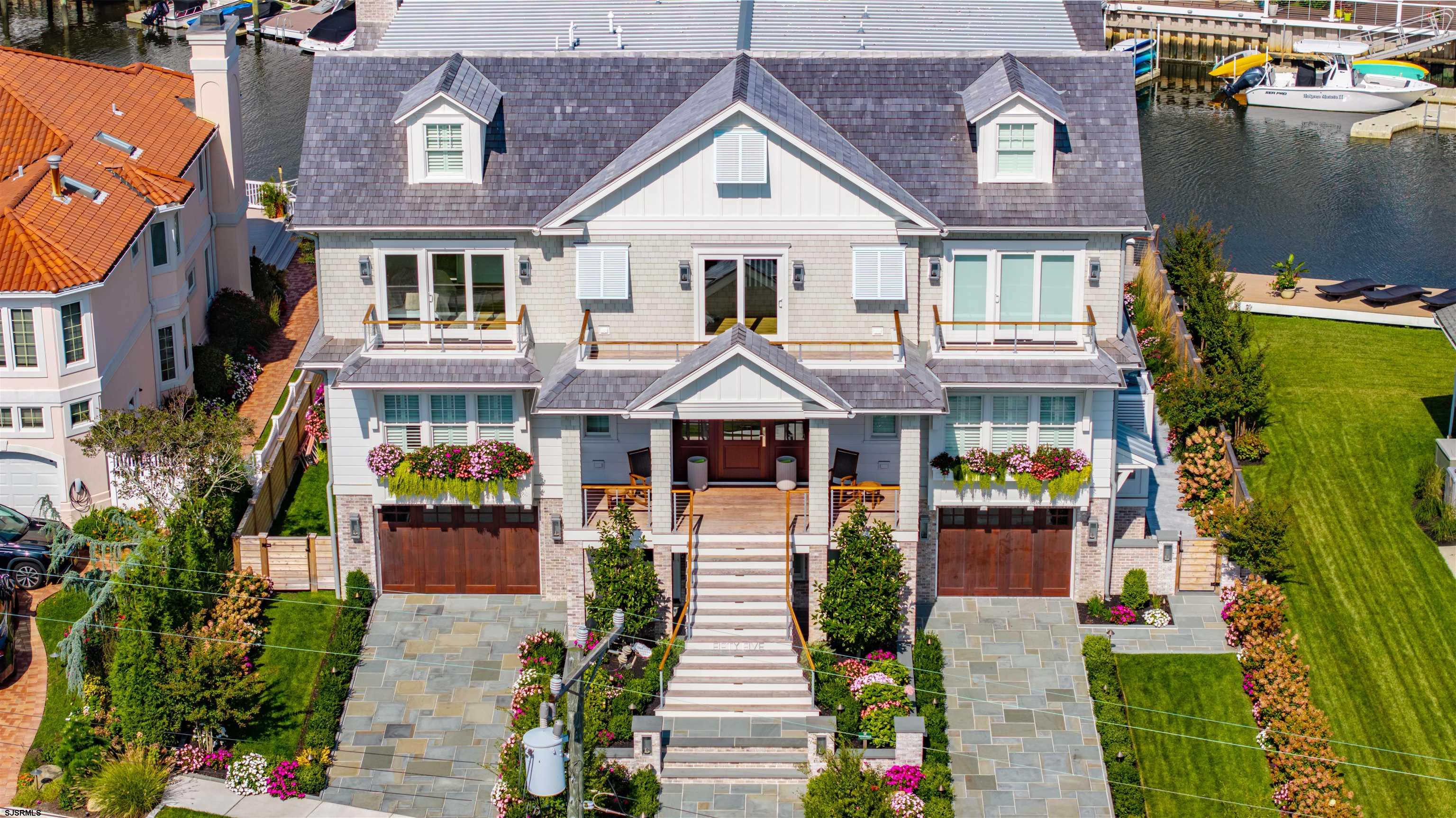 55 Walnut Road Ocean City, NJ 08226 - Photo 84 of 97 a front view of a house with a garden