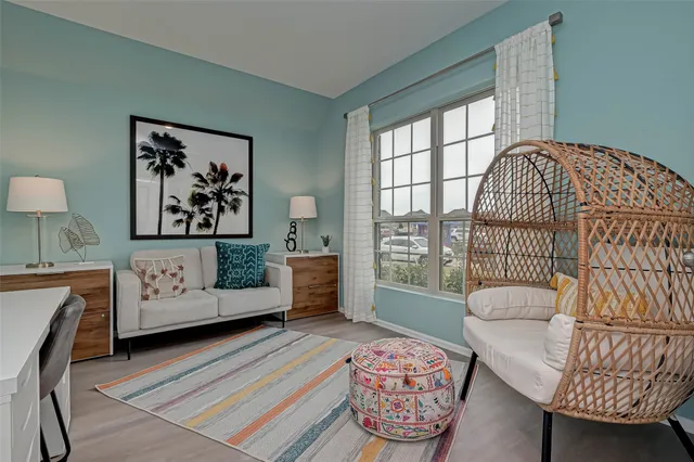 a living room with furniture and a window