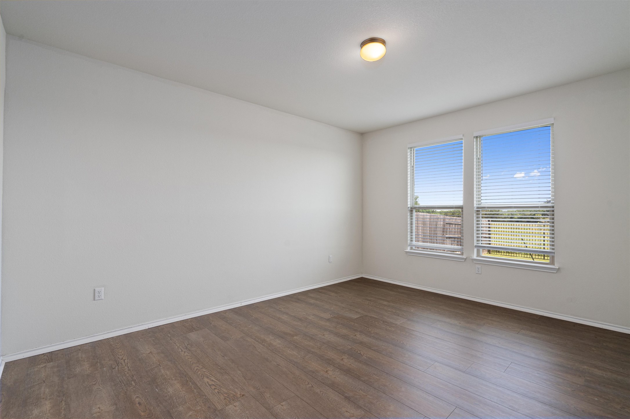146 Russet Trail Georgetown, TX 78628 - Photo 15 of 37 an empty room with wooden floor and windows