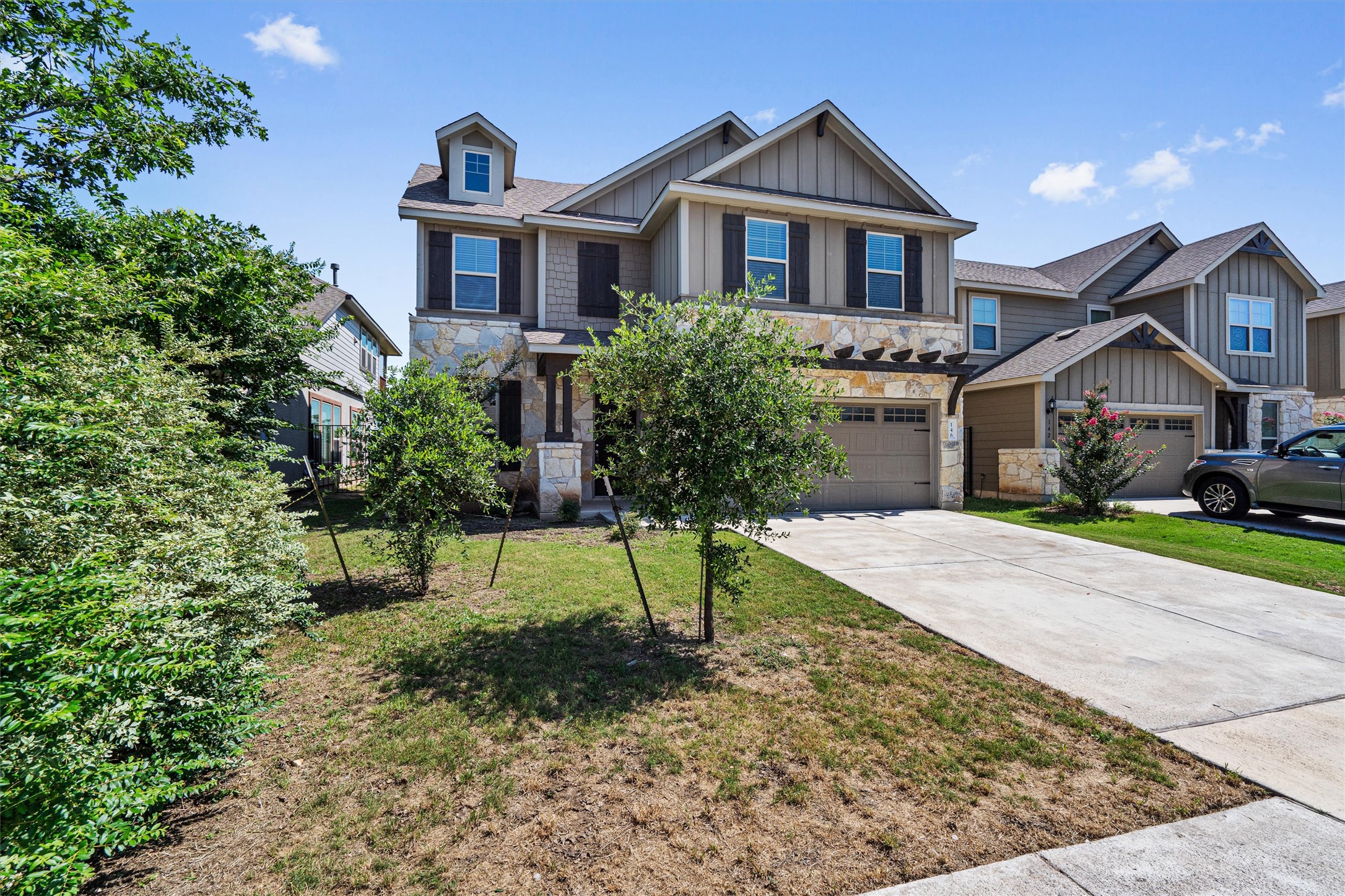 146 Russet Trail Georgetown, TX 78628 - Photo 2 of 37 a house that has a yard and large trees