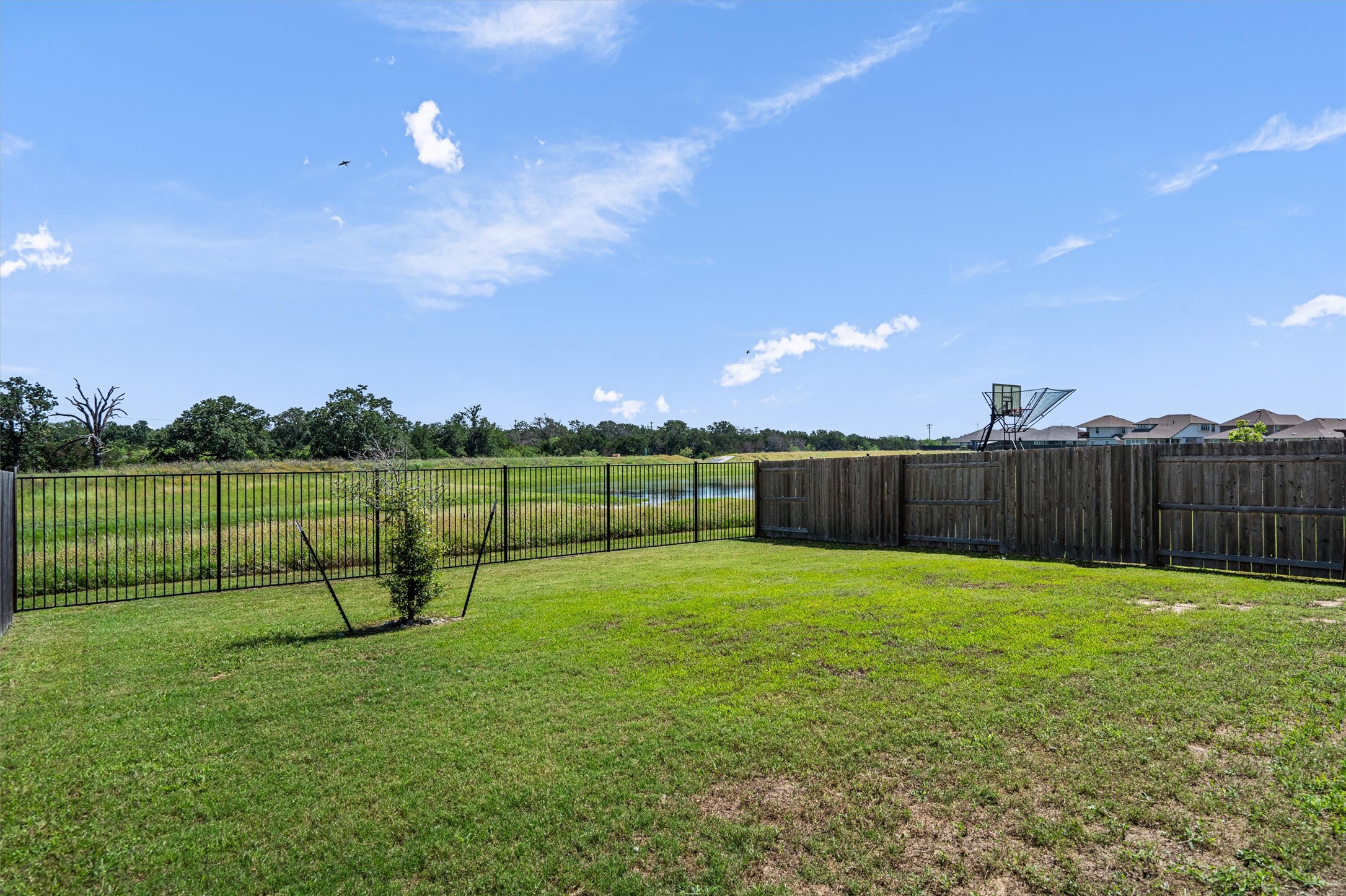 146 Russet Trail Georgetown, TX 78628 - Photo 32 of 37 a view of a backyard with a slide