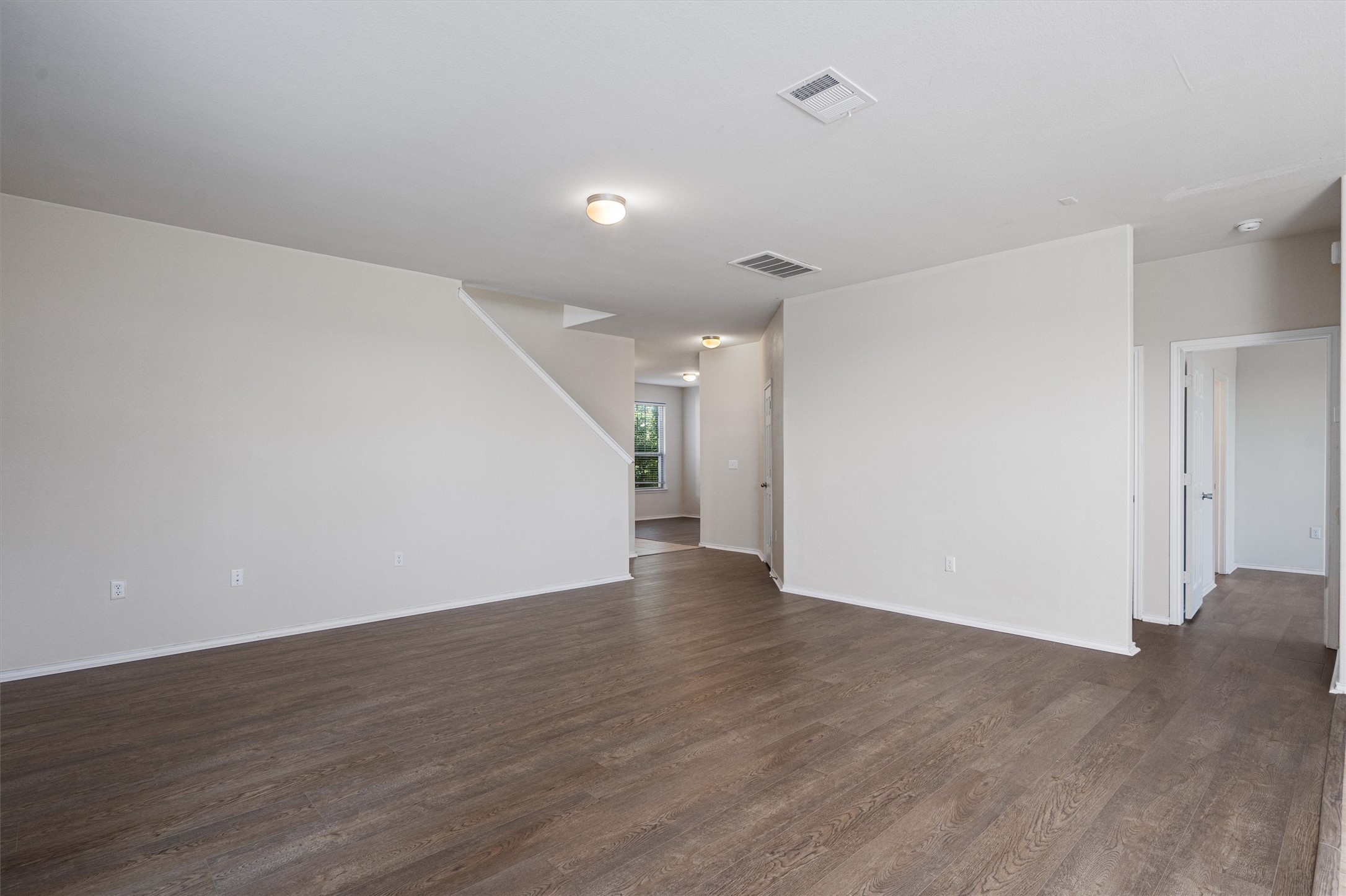 146 Russet Trail Georgetown, TX 78628 - Photo 7 of 37 a view of an empty room with wooden floor
