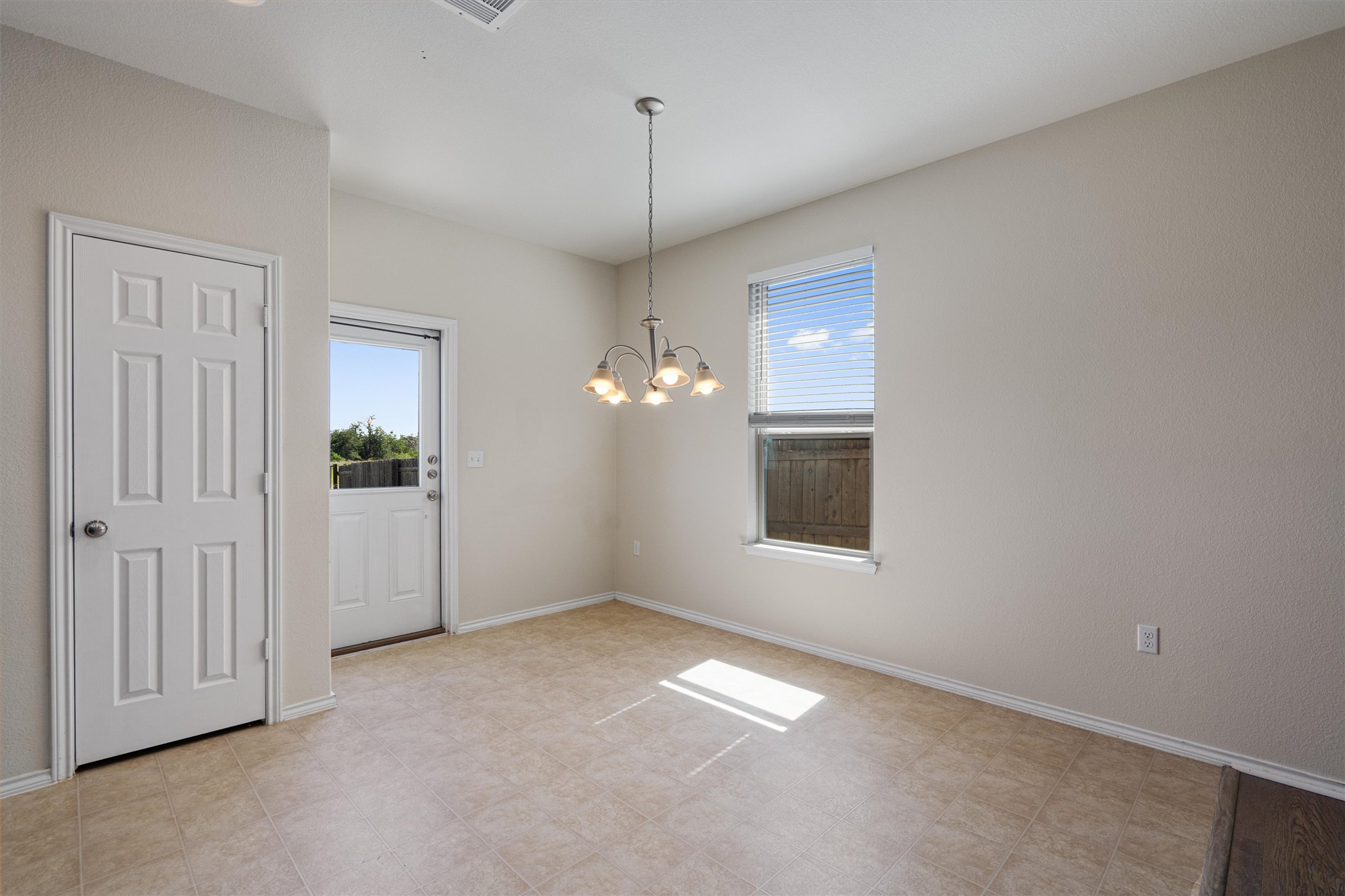 146 Russet Trail Georgetown, TX 78628 - Photo 9 of 37 an empty room with windows and entrance