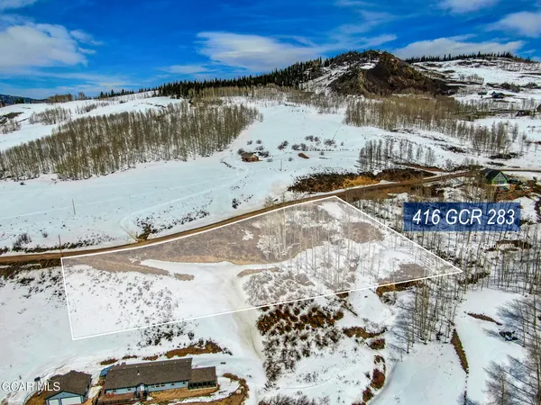 a view of ocean with a building in the background