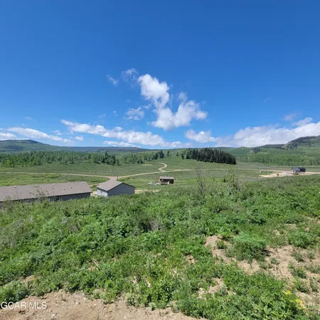 a view of a road with a mountain in the background