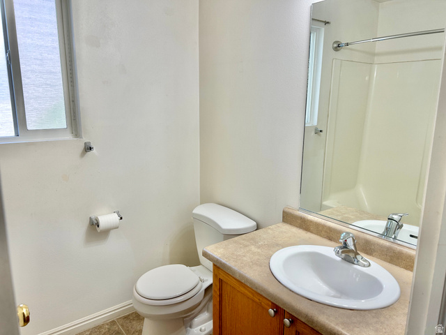 334 West Rodeo Lane South Logan, UT 84321 - Photo 8 of 12 Bathroom featuring a vanity with a laminate countertop, an oval sink, and a chrome faucet