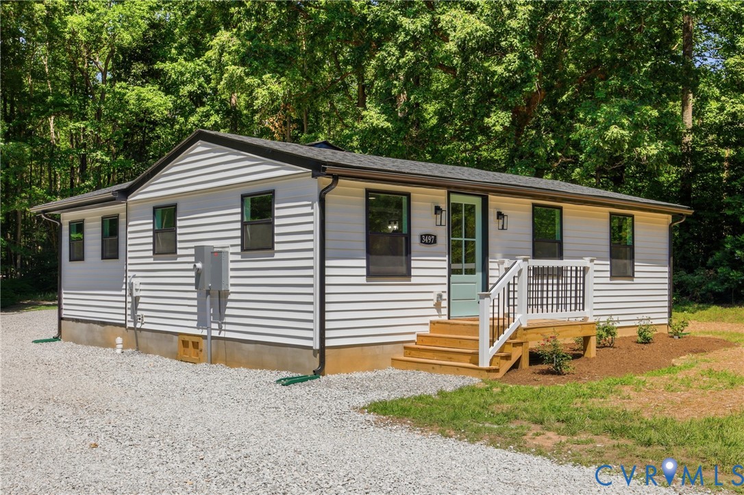 3497 Bumpass Road Beaverdam, VA 23015 - Photo 1 of 28 White horizontal siding exterior with black trim a