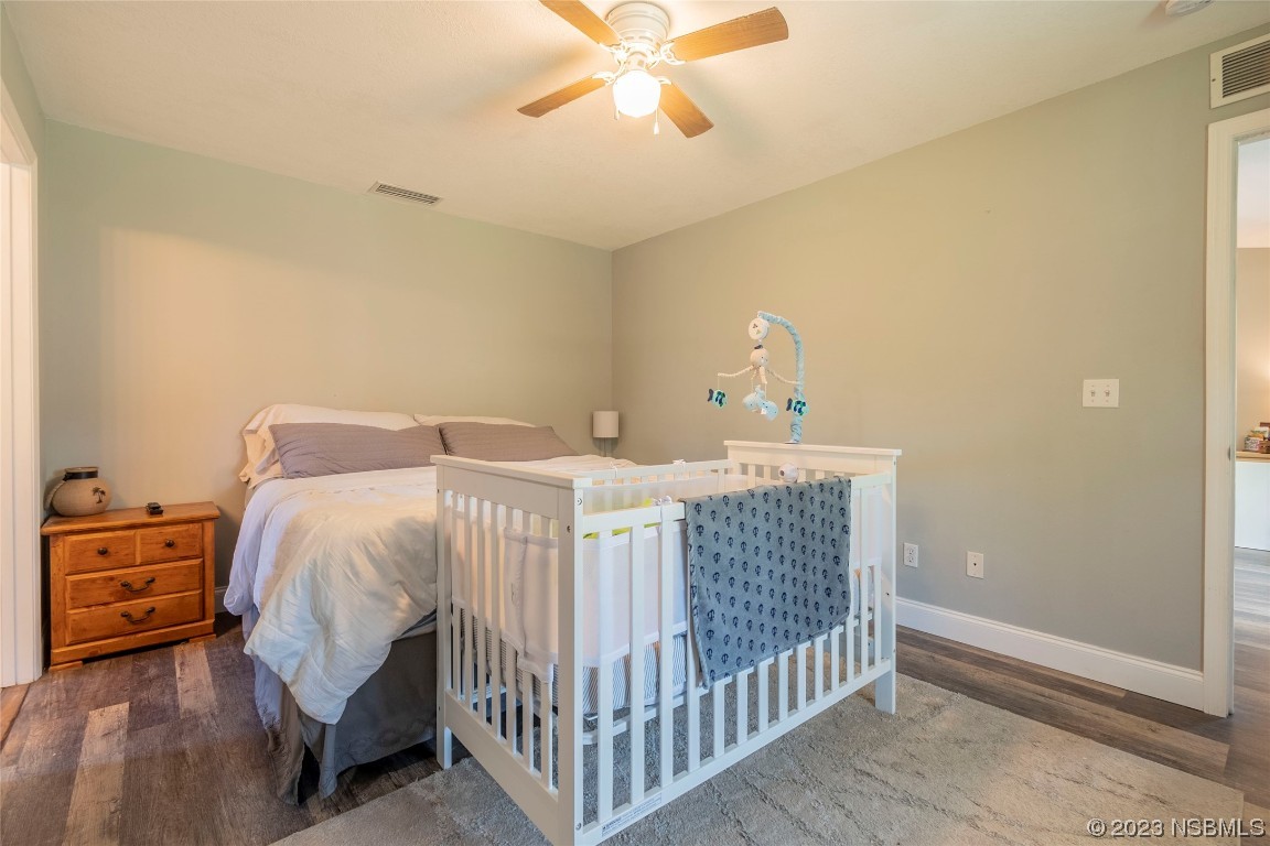 2716 Juniper Drive Edgewater, FL 32141 - Photo 14 of 30 a bedroom with a bed and a window