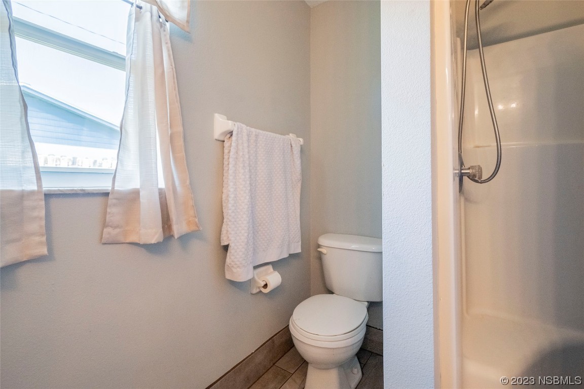 2716 Juniper Drive Edgewater, FL 32141 - Photo 18 of 30 a bathroom with a toilet and a shower