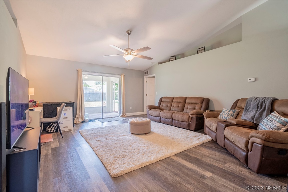 2716 Juniper Drive Edgewater, FL 32141 - Photo 8 of 30 a living room with furniture large window and wooden floor