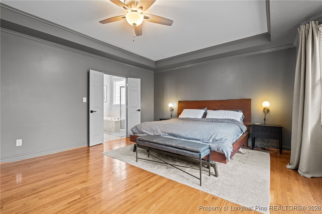 16 Cottswold Lane Spring Lake, NC 28390 - Photo 17 of 49 a bedroom with a bed and a chandelier