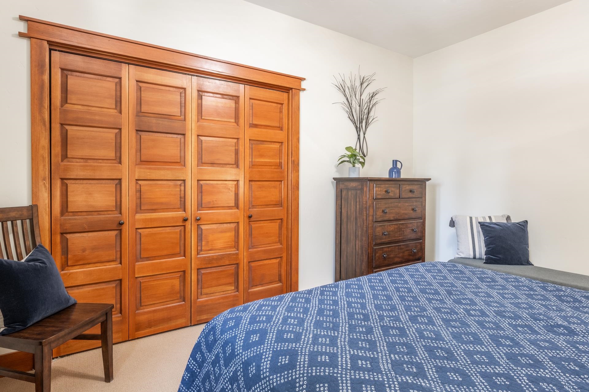 125 Davison Road, Unit 1 Mammoth Lakes, CA 93546 - Photo 27 of 46 a bedroom with a bed and a dresser