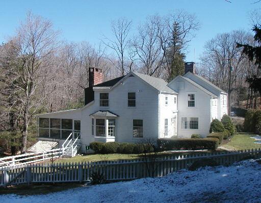 656 Den Road Stamford, CT 06903 - Photo 1 of 1 a front view of a house with a yard