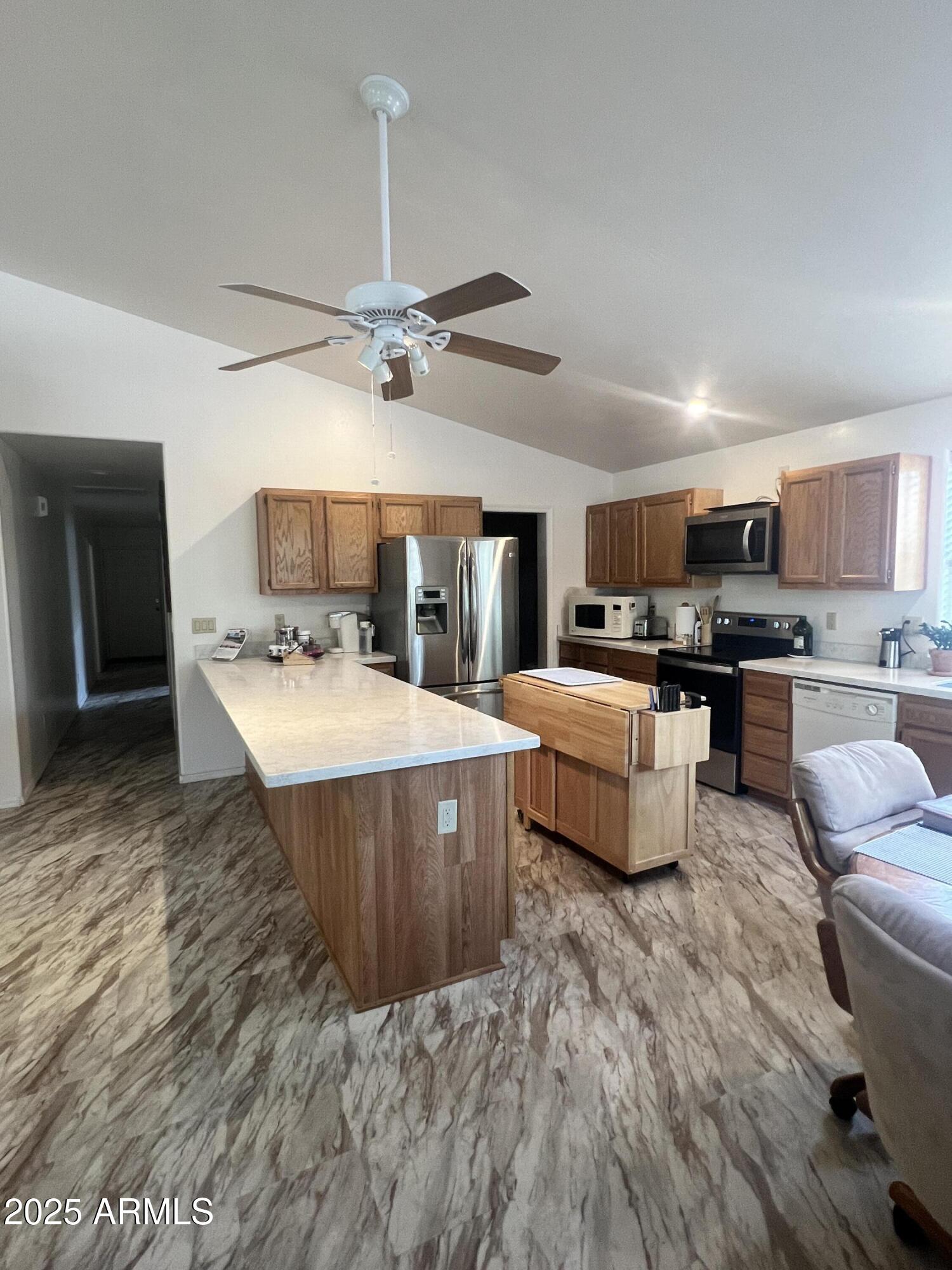 401 East Alpine Drive Payson, AZ 85541 - Photo 18 of 30 a large room with kitchen island stainless steel appliances wooden floors and view living room