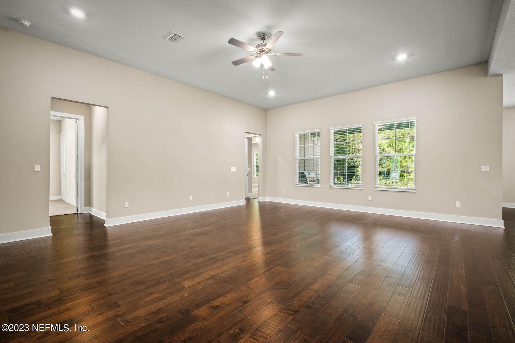 36426 Pitch Lane Hilliard, FL 32046 - Photo 5 of 14 a view of an empty room with window and wooden floor