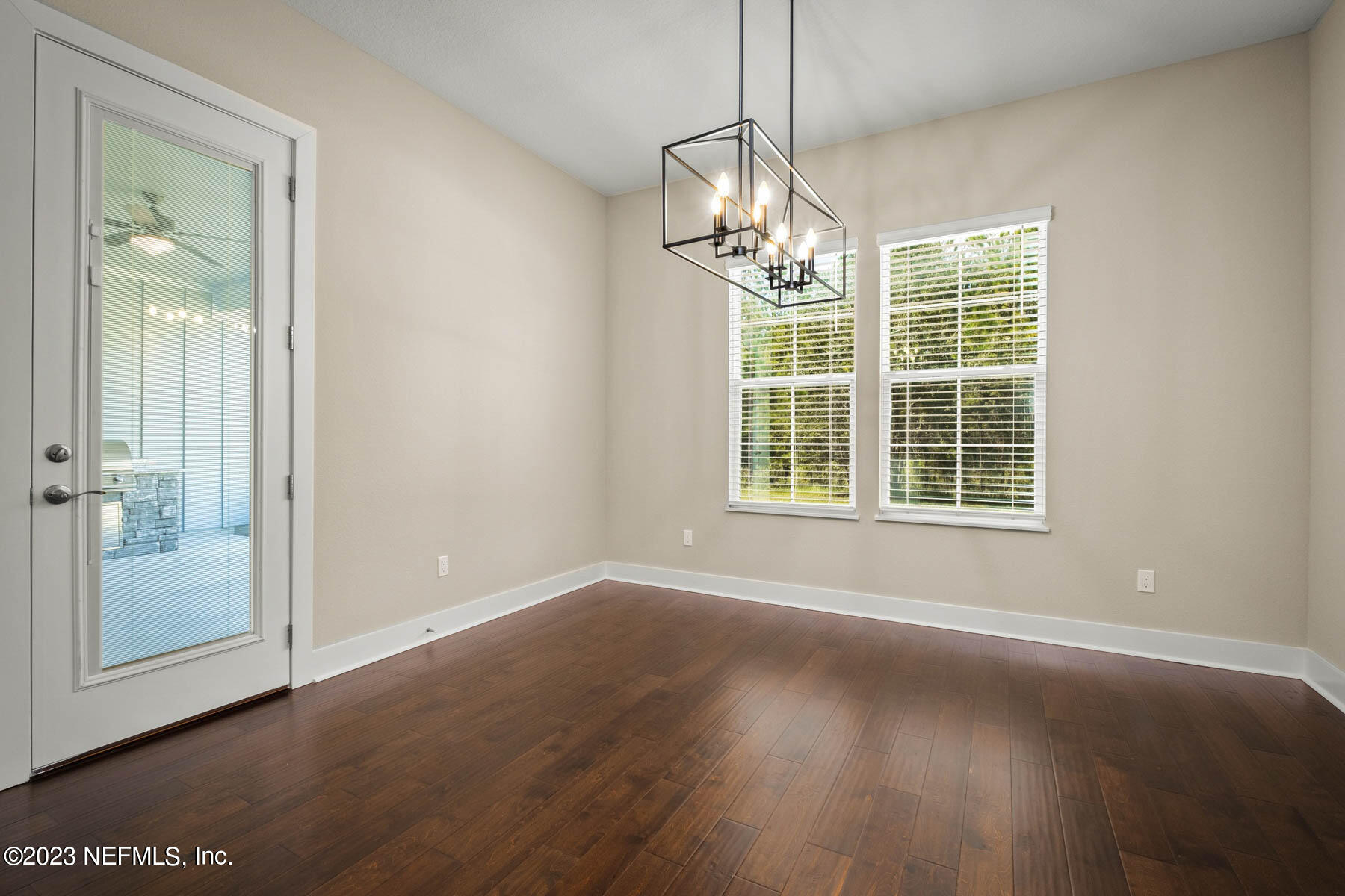 36426 Pitch Lane Hilliard, FL 32046 - Photo 9 of 14 a view of empty room with wooden floor and fan