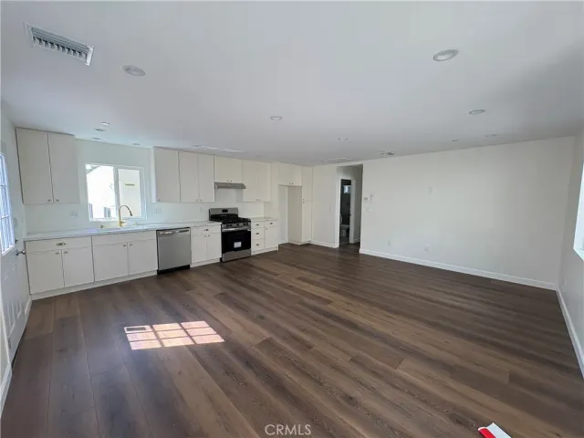 a kitchen with a stove and a sink