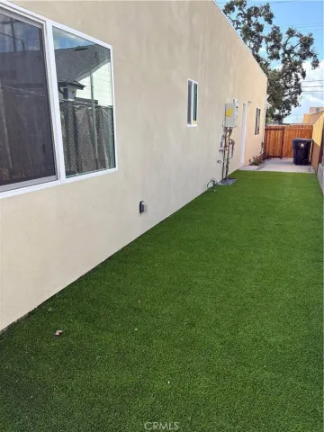 a view of a backyard with potted plants
